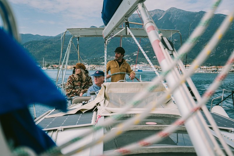 A family sitting down on a boat.