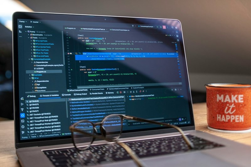 Computer screen displaying coding software and automation scripts used by IT professionals and developers.