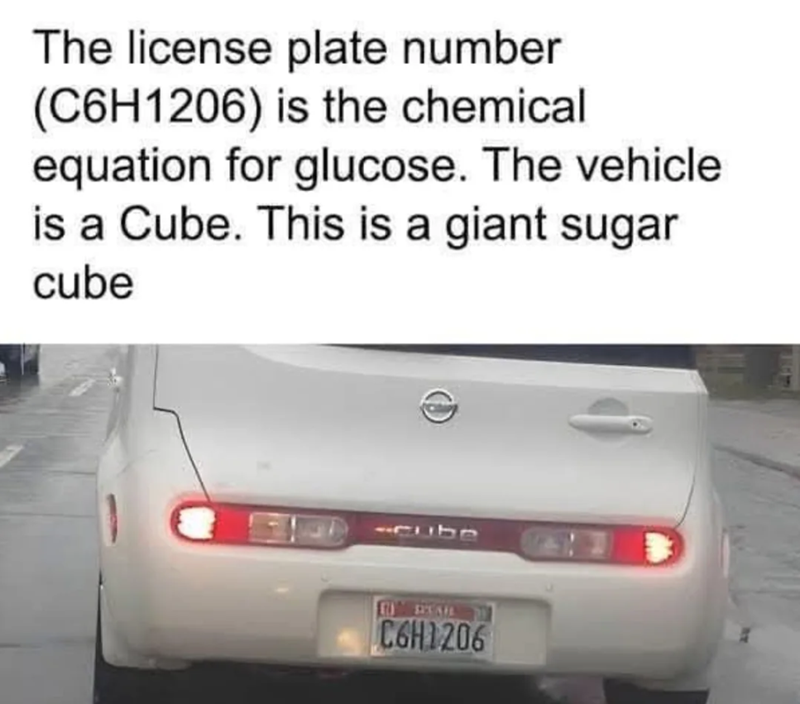 The license plate number (C6H1206) is the chemical equation for glucose. The vehicle is a Cube. This is a giant sugar cube -cube C6H1206