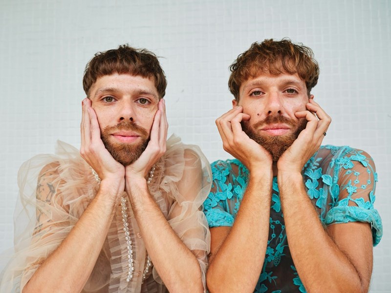 Twin brothers posing to the camera