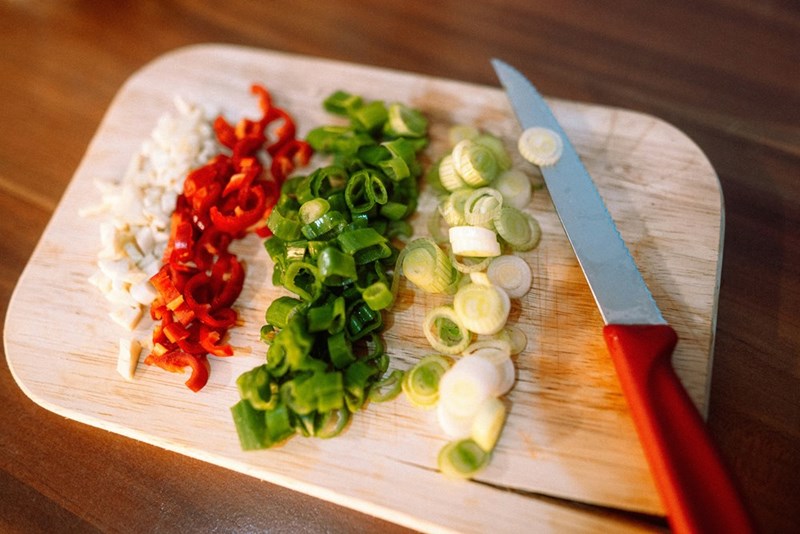 Sliced green vegetable on white ceramic plate