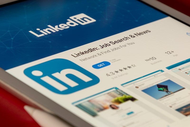 A phone open to the LinkedIn app