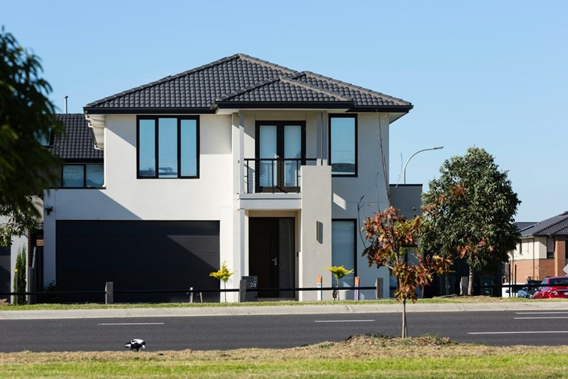A residential house for sale with no signage visible. 