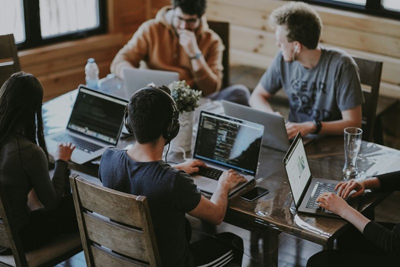 Group of people working on their laptops