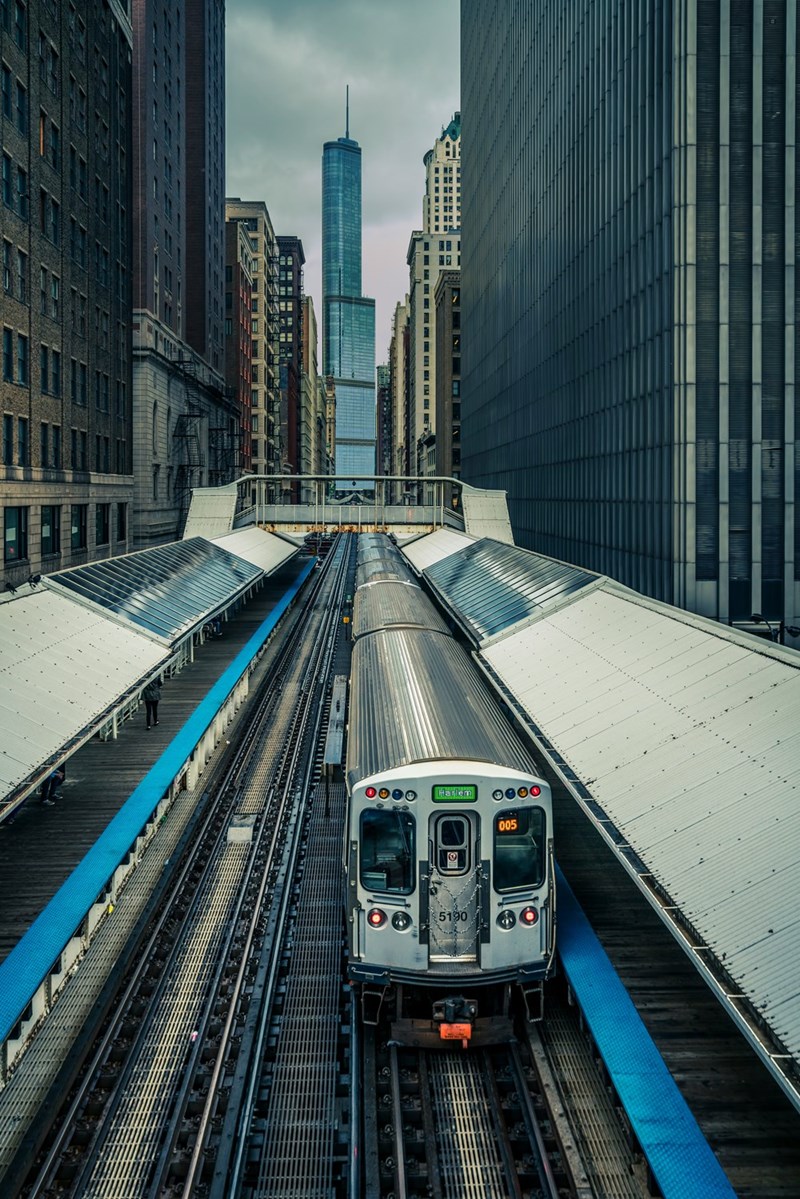 NYC subway train with the Freedom Tower in the background.