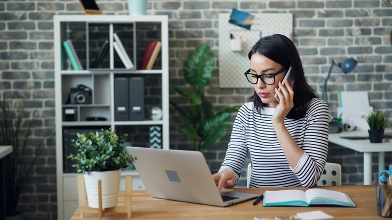Receptionist on the phone realizes she is training her replacement, as recreated by a model. 