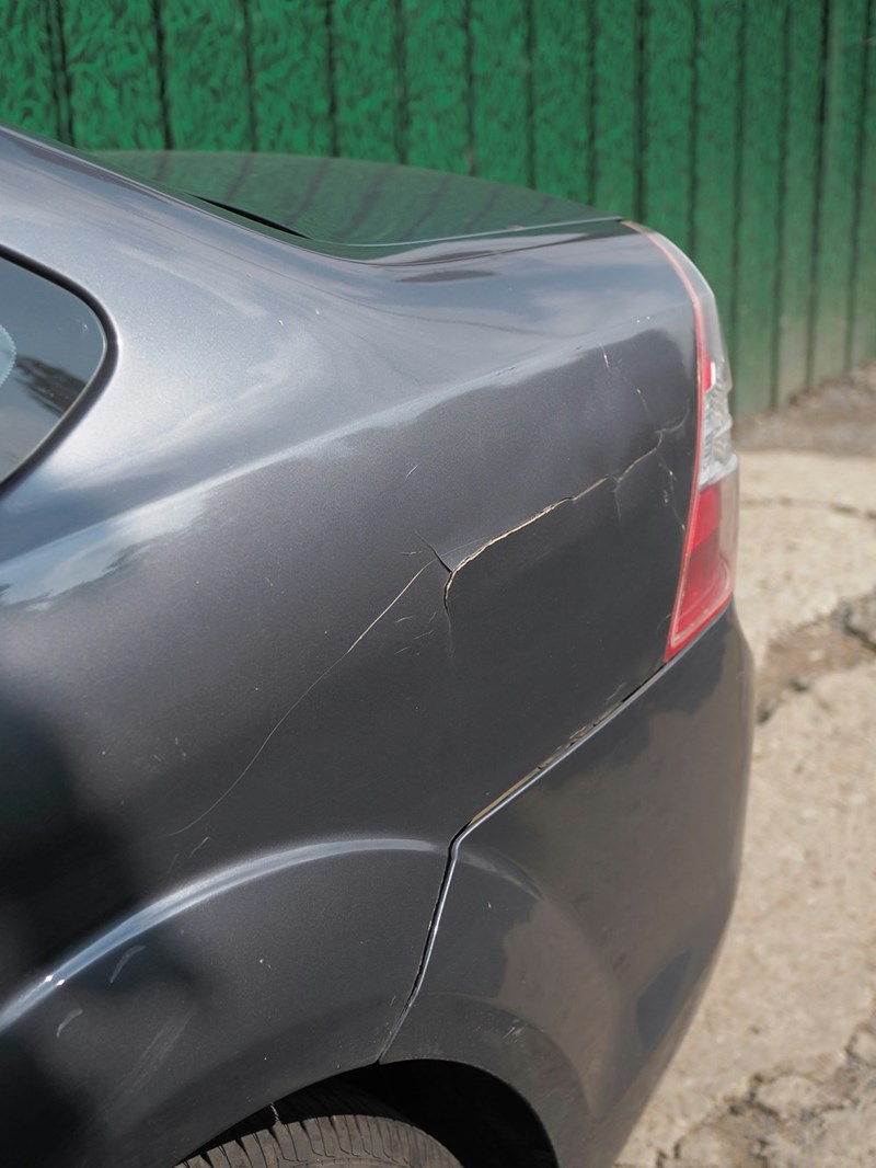 Scraped grey car.