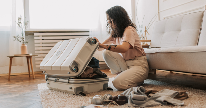 A Woman Packing Her Luggage