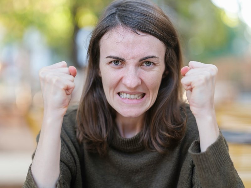 A woman who could be angry about her ex-husband playing video games with his son while he's at her house.