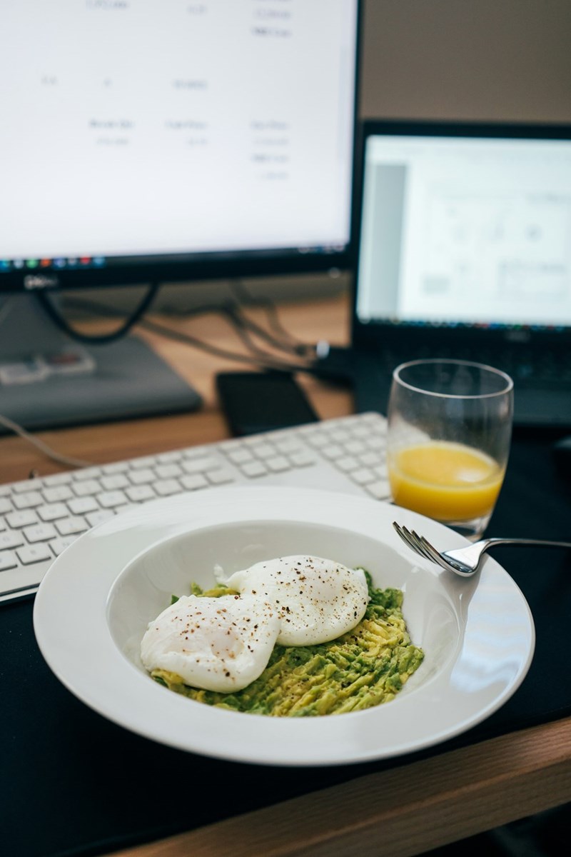 A picture of an employee's breakfast that they're finishing at the beginning of the workday while they check their emails
