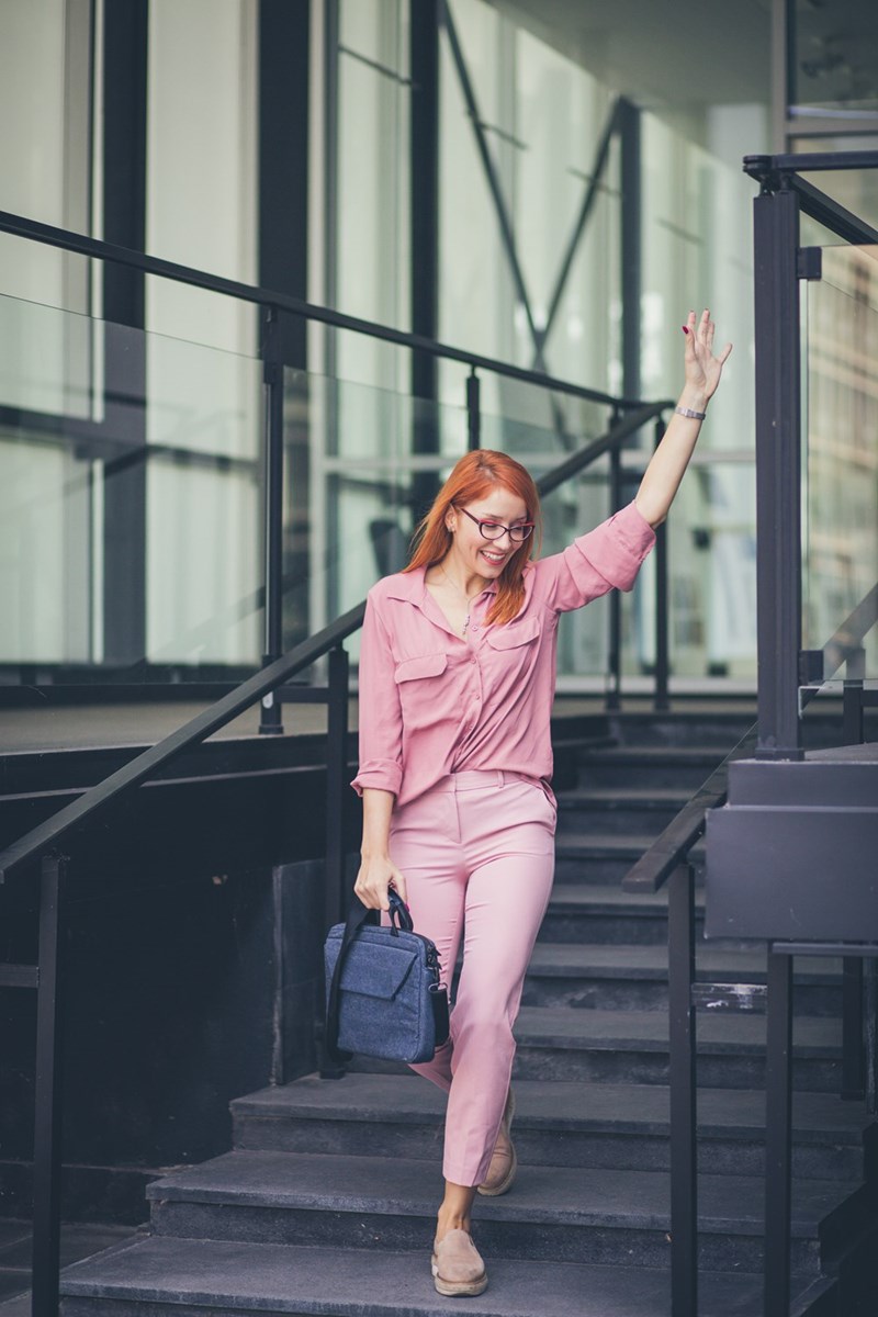 A representation of an employee happily leaving the office at the end of the workday