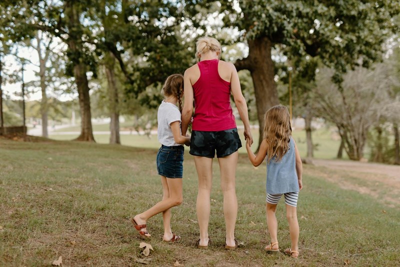 Three models who could be the daughter of the original poster and her two daughters, who are mourning the tragic loss of their father at a young age.