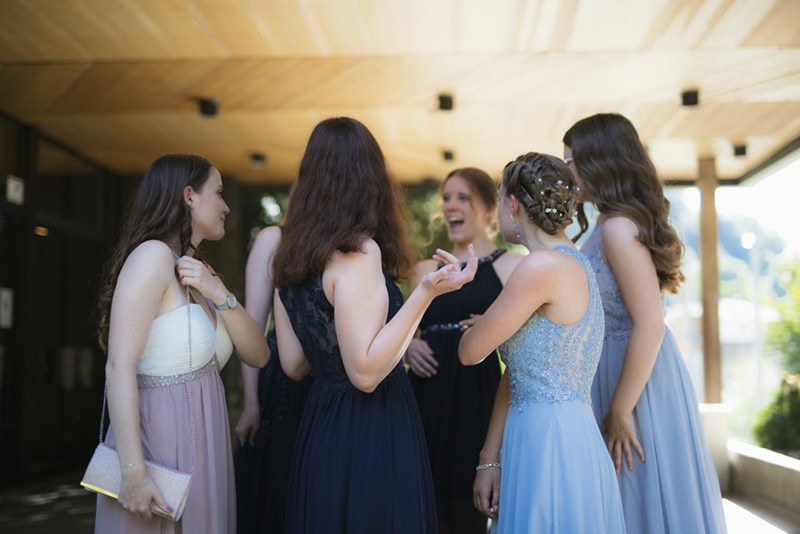 Bridal party members socializing during wedding festivities