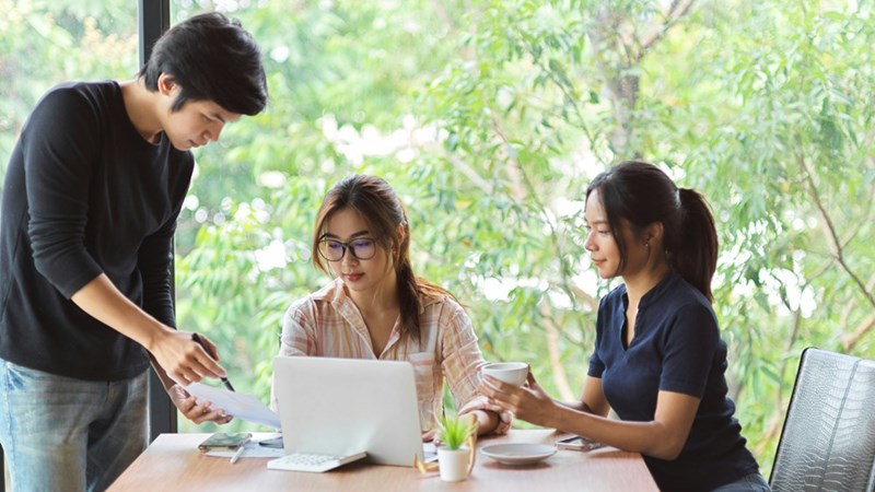 Subjects depict employees who are discussing ways to get out of financial trouble after a consultant spends half a billion dollars on AI tokens.