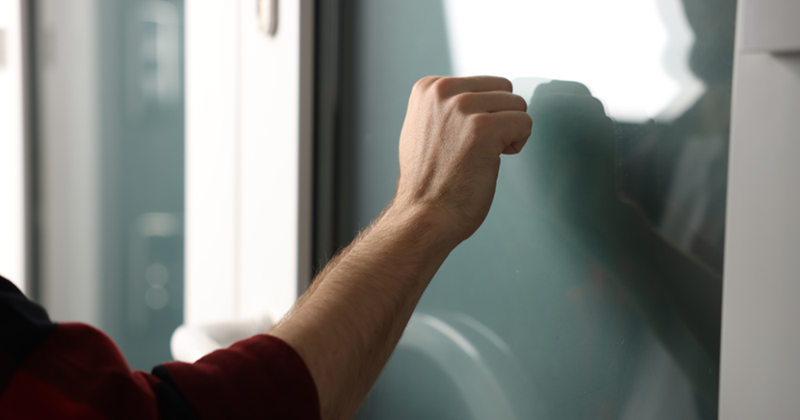 Man (Model) Knocking on Apartment Door, Closeup View