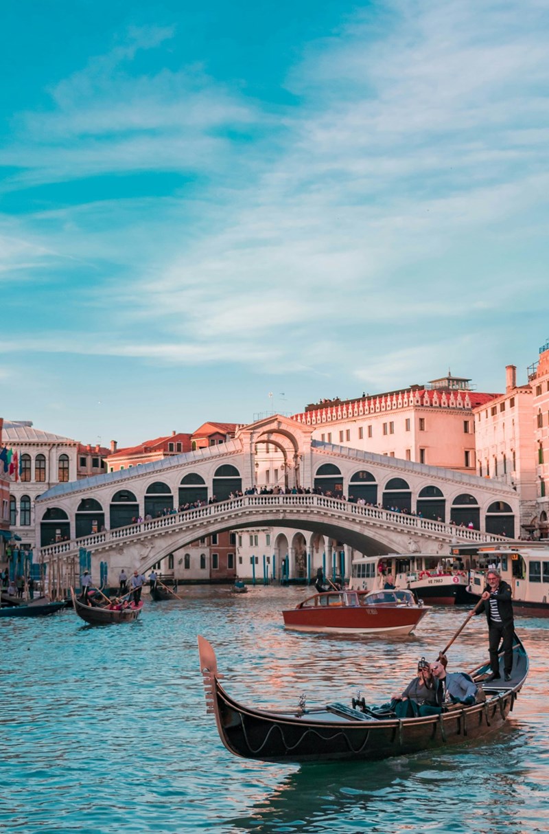 Gondolas float through city in Italy, in a depiction with models.