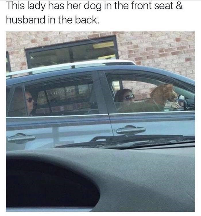 This lady has her dog in the front seat & husband in the back. 100