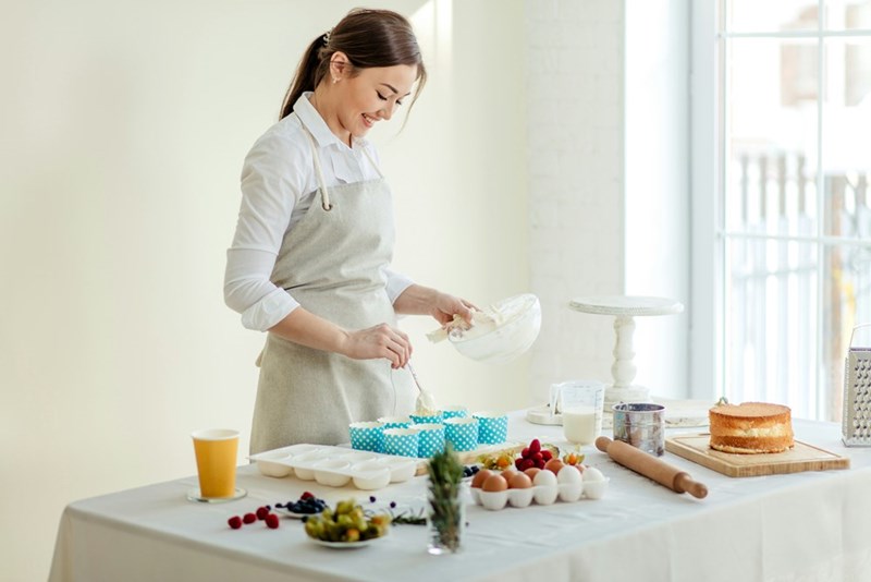 Woman prepares meals for herself and her husband, as demonstrated by a model.