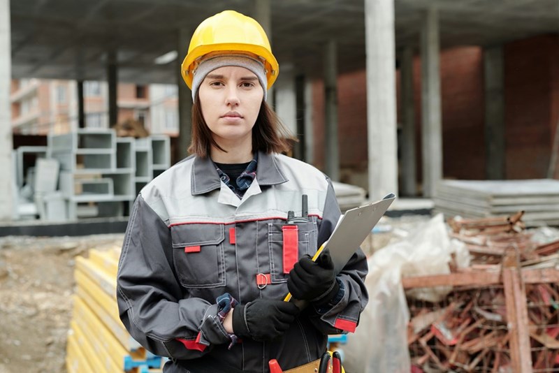 Worker gives a look of frustration while enduring difficult.