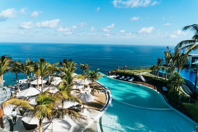 Swimming pool and bungalows near ocean