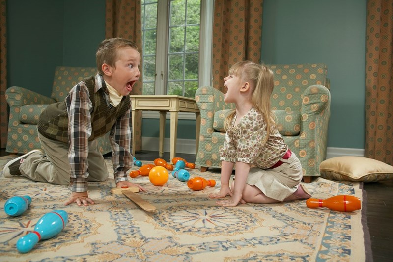 Kids playing at home, making loud noise with a bowling set and upsetting downstairs neighbor.