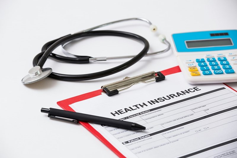 A photo of what could be an employee's health insurance, which now doesn't cover as many procedures as it used to.