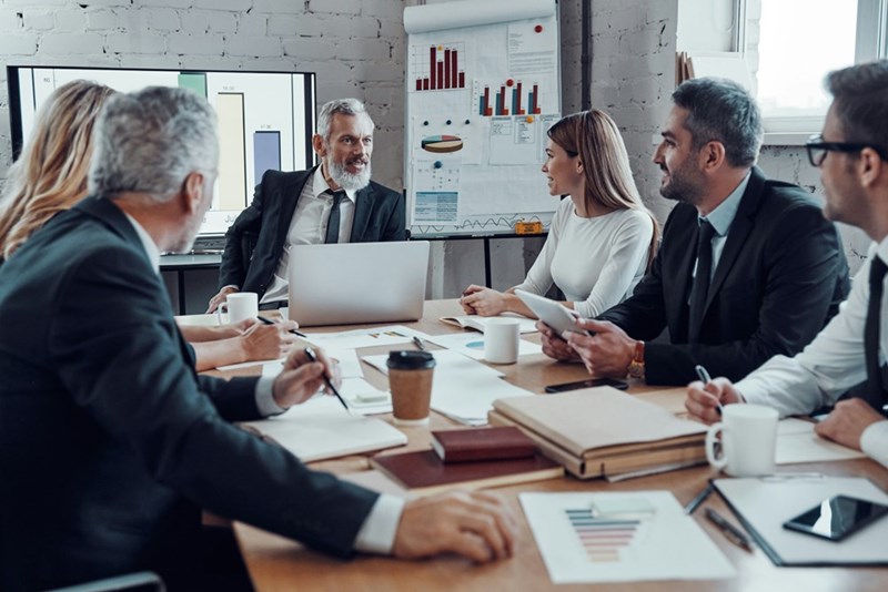 Team members discussing ideas and strategies during a business meeting.