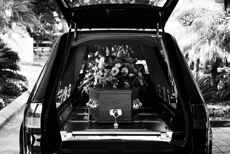A car carrying a casquet with flowers, model image.