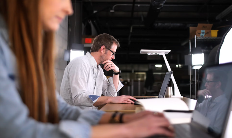 Coworkers work together in an office.