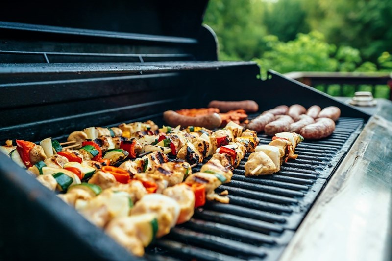 A grill with food, representation.