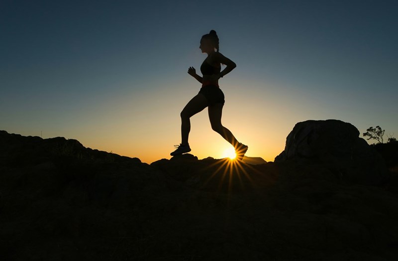 silhouette of a woman running