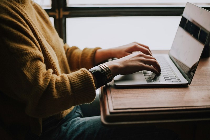 Image of what could be a man working on a computer.