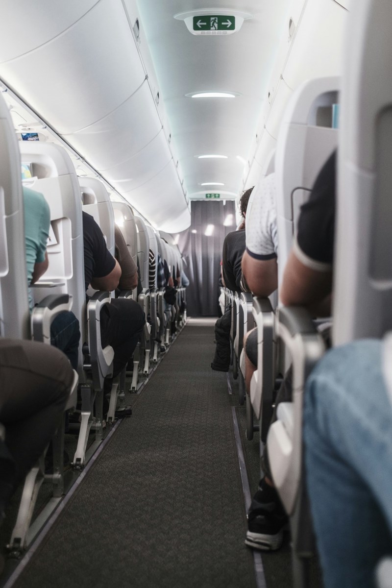 a view down the aisle of a commercial plane