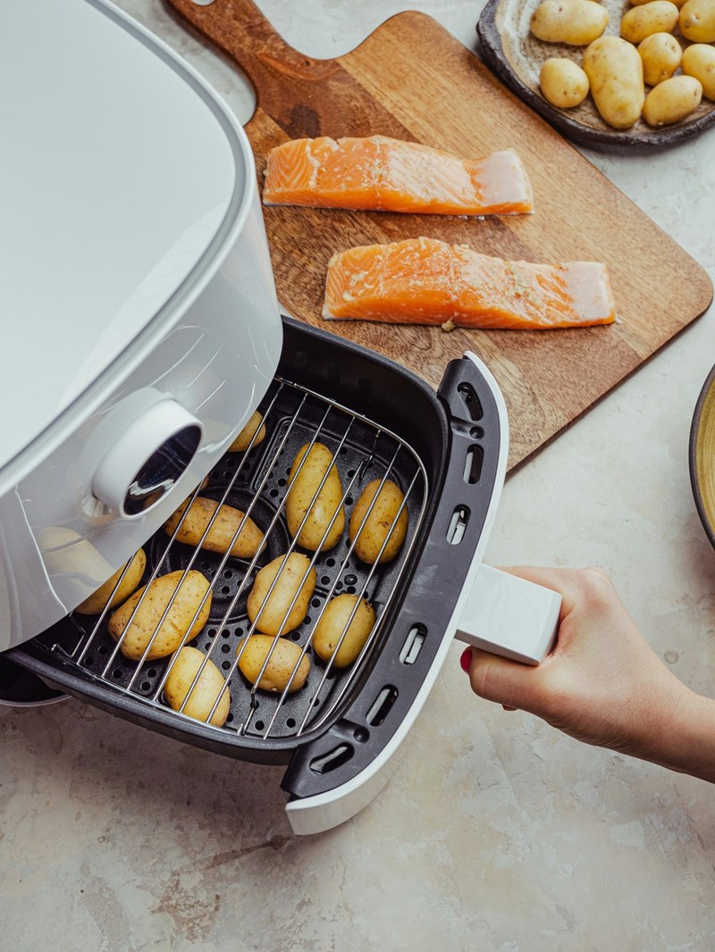 Air fryer frying up some potatoes