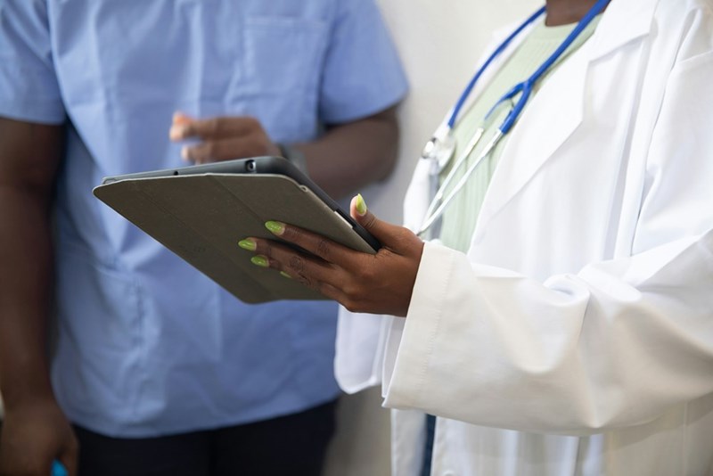 A picture of what could be two medical workers discussing results.