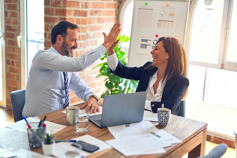 A boss and an employee agreeing on something, model image.