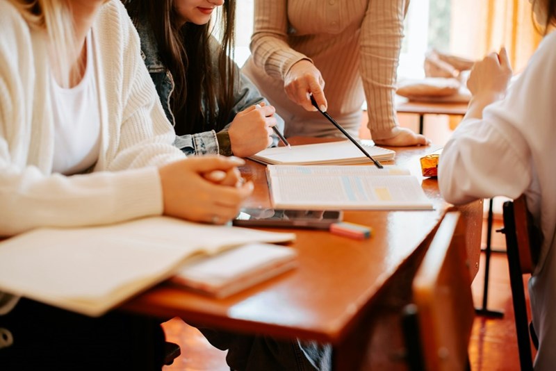 University students working together in a classroom during an academic discussion.