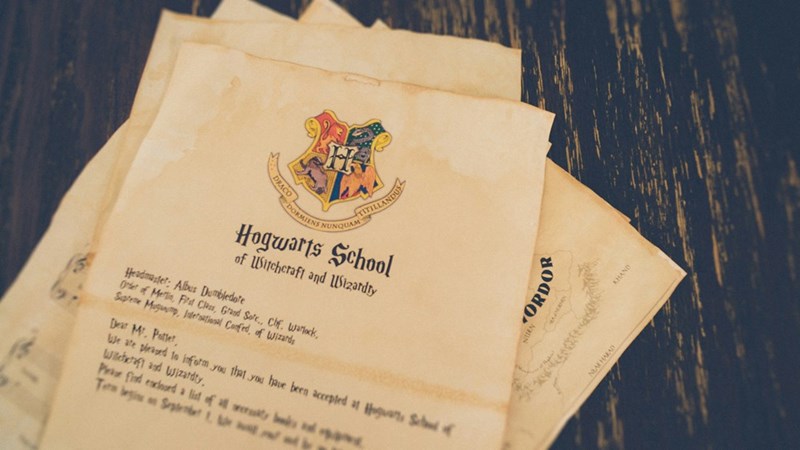 DRACO TITILLANDUS RMIENS NUNQUAM Hogwarts School of Witchcraft and Wizardry Headmaster: Albus Dumbledore Order of Merlin, First Class, Grand Sofc., Chf. Warlock, Supreme Mugum, Inernational Confed, of Wizards Dear Mr. Potter, We are pleased to inform you that you have been accepted at Hogwarts Schof Witchcraft and Wizardry. Please find enclosed a list of all werty Ten begin on September 1, wat ORDOR NEAK HARAD KHAND