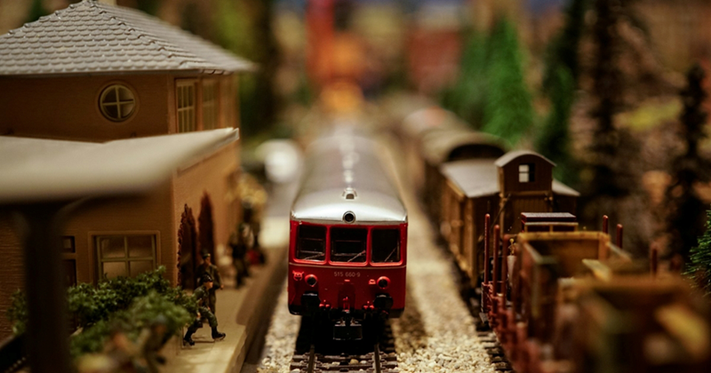 Close-up of a model train stopped at a train station