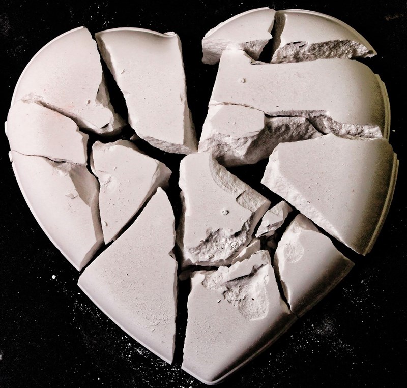 a broken heart shaped cake