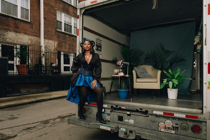 woman sitting in a moving truck