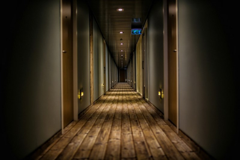 Model image of a corridor at a hotel.