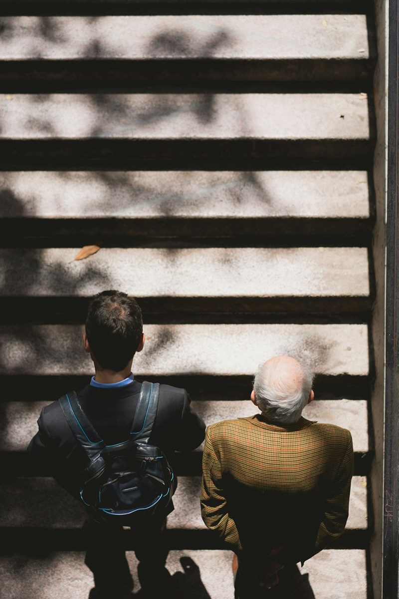 two men walking on stairs