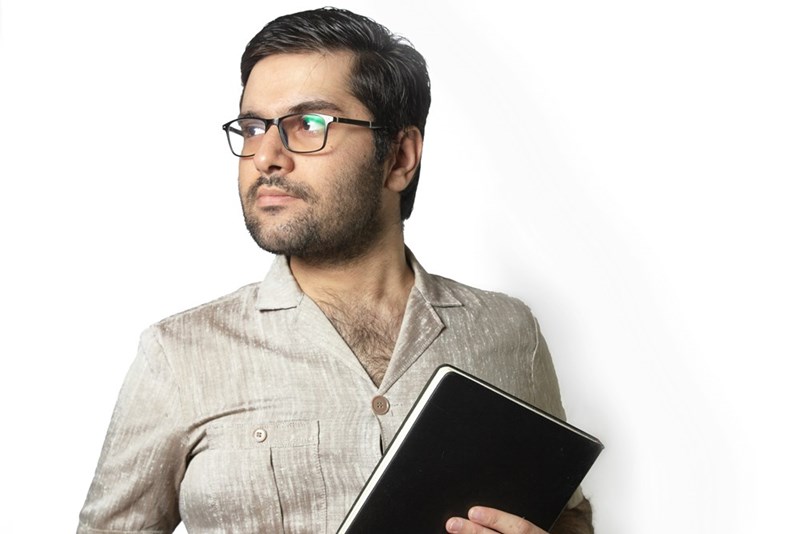man holding papers