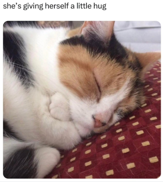 she's giving herself a little hug
