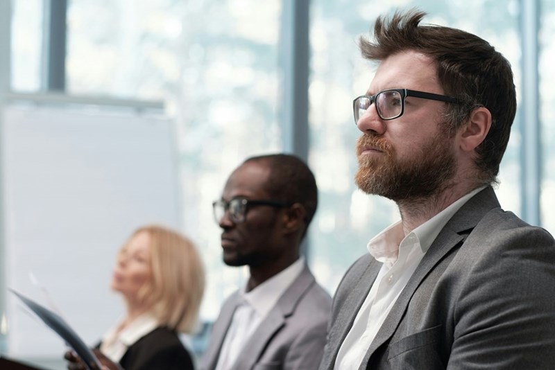 Serious workers during a business meeting, presented by models.