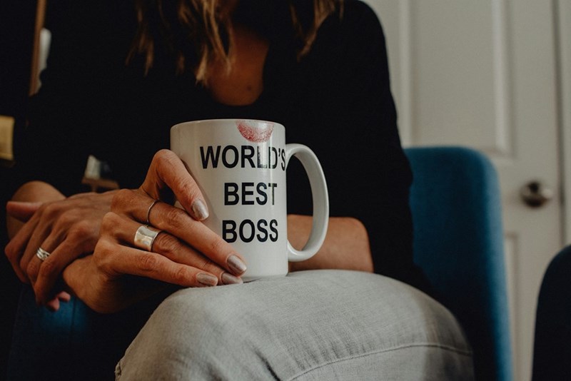 Woman holding a ‘World’s best boss' mug