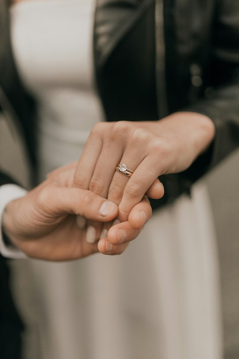 A close-up of a wedding ring, symbolizing an engagement put on hold after a fiancée discovers the truth.