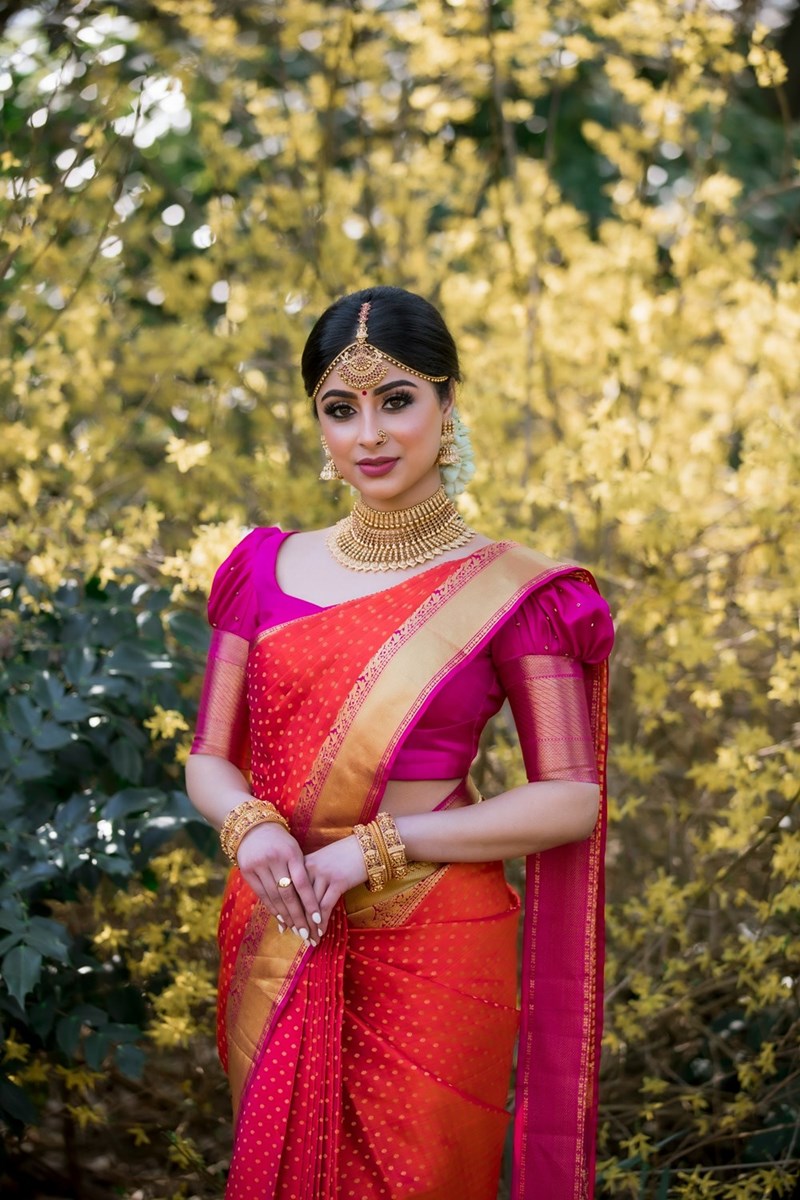 A woman wears a saree for an Indian wedding (model).