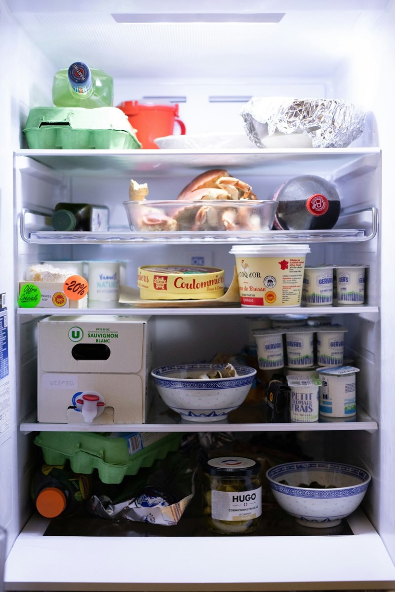 An open refrigerator stocked with food and containers, illustrating the pantry and leftovers a sister-in-law kept taking without asking.
